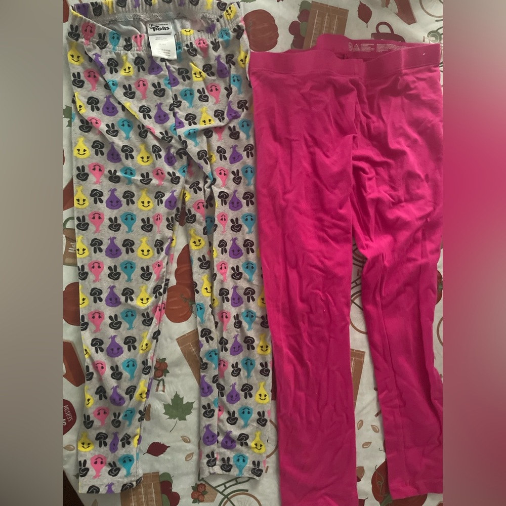 Two pairs of stretchy girl leggings.